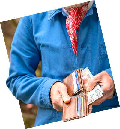 an image of a person removing money from their wallet